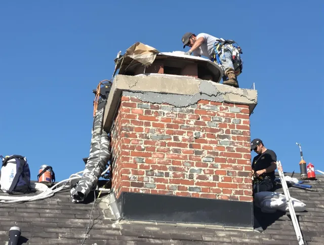 Cleveland Heights Chimney Sweep installing a custom chimney crown in Cleveland Heights, OH