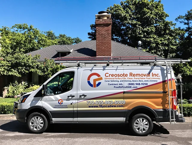 Cleveland Heights Chimney Sweep technician removing creosote safely in Cleveland Heights, OH