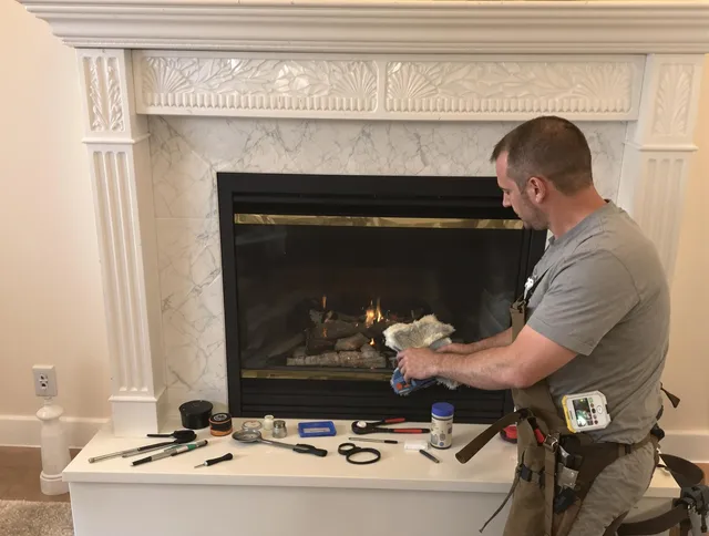 Cleveland Heights Chimney Sweep performing fireplace maintenance in Cleveland Heights, OH